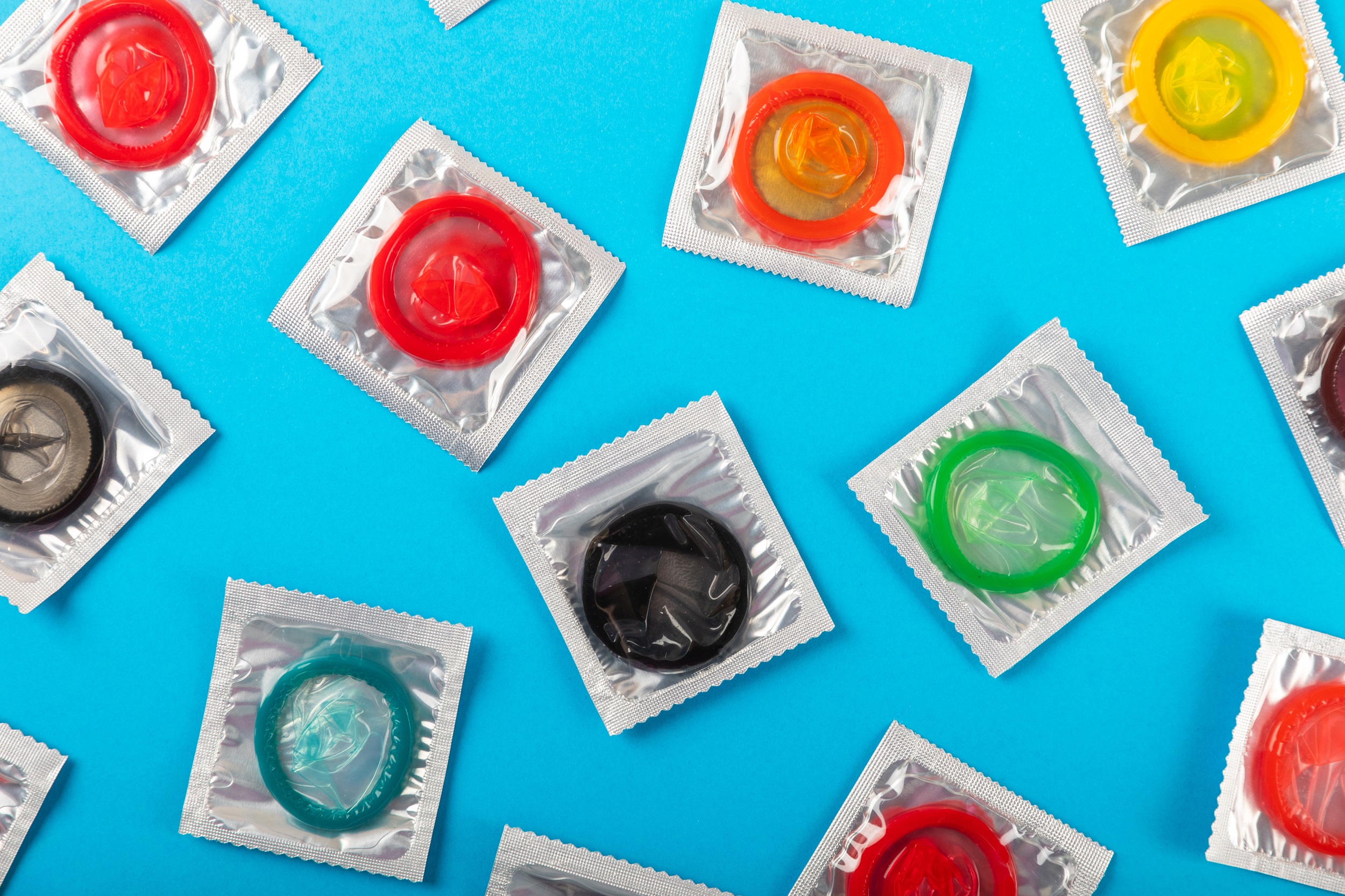 Packages of condoms in different colours.