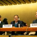 Mr Arun Singhal of India sitting wit two men